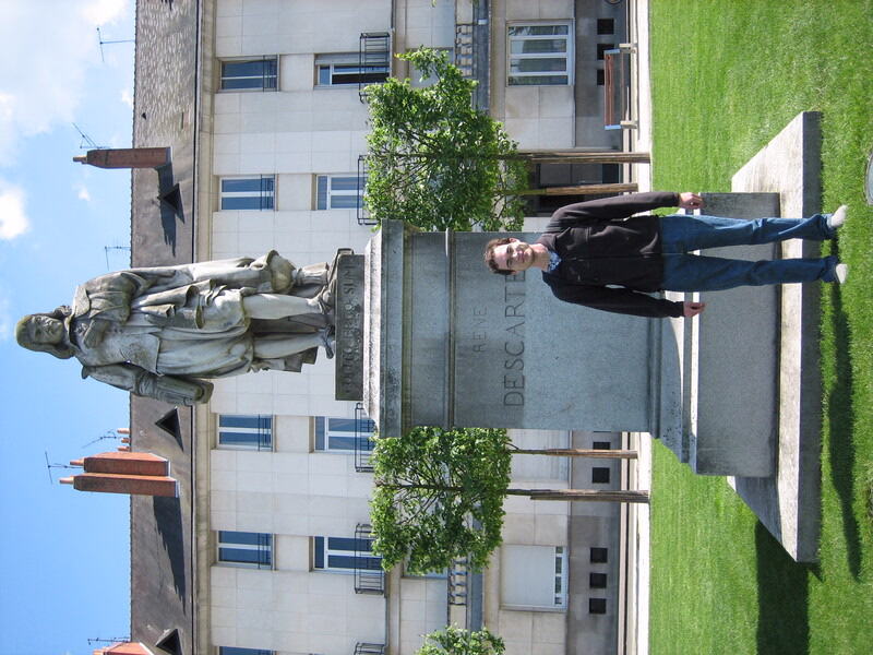 Me standing in front of a statue of Descartes in Tours, France in 2007